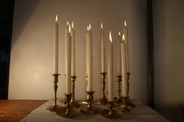 istock Burning candles in retro candlesticks indoor. 1183988174