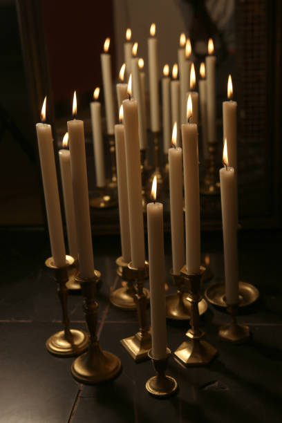 istock Burning candles in retro candlesticks indoor. 1183988258