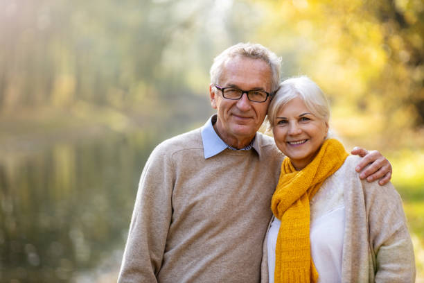 istock Happy senior couple in autumn park 1183991097