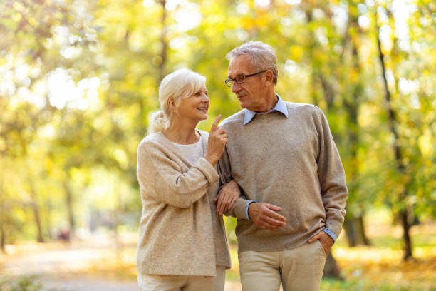 istock Happy senior couple in autumn park 1183991182