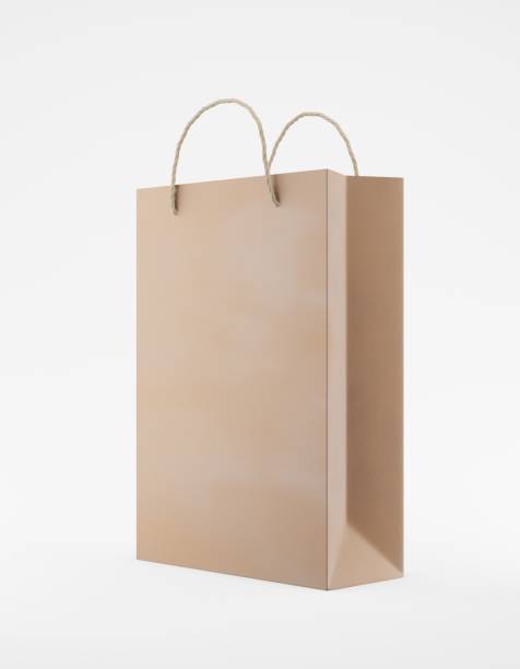istock Eco packaging mockup bag kraft paper with handle half side. Standard medium brown template on white background promotional advertising. 3D rendering 1183992669