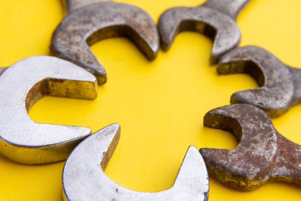 istock Old wrenches on a yellow background. From above. Copy space. Frame 1183992793