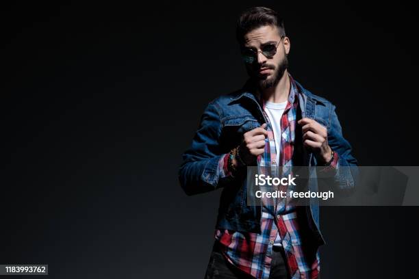 Determined Casual Man Holding Both Fists Clenched Stock Photo - Download Image Now - 20-29 Years, Adult, Adults Only