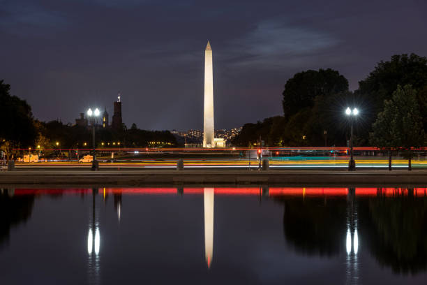 istock Washington Monument - A night view of Washington Monument reflected in Capitol Reflecting Pool. Washington, D.C., USA. 1183993872