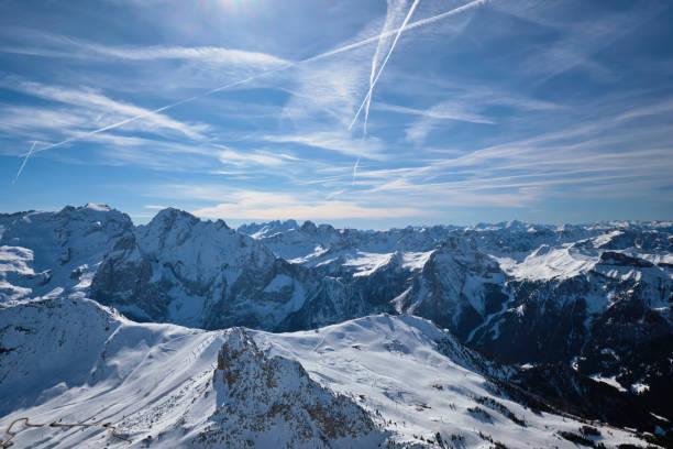 View of a ski resort piste and Dolomites mountains in Italy from Passo Pordoi pass. Arabba, Italy