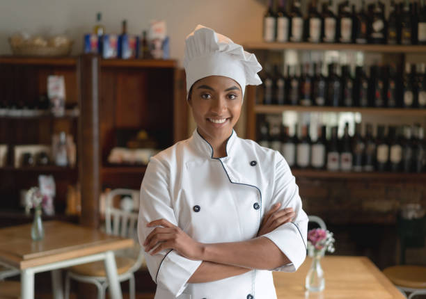 istock Happy female chef working at a restaurant 1183994208