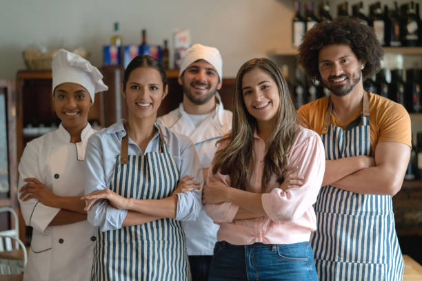 istock Business owner at a restaurant with her staff 1183994220
