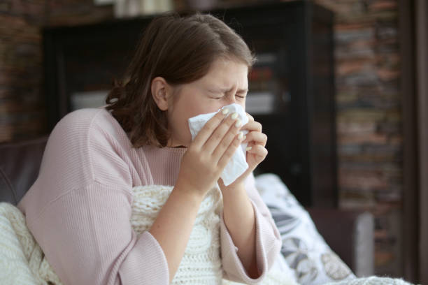 istock young girl is sick in the room 1183995607