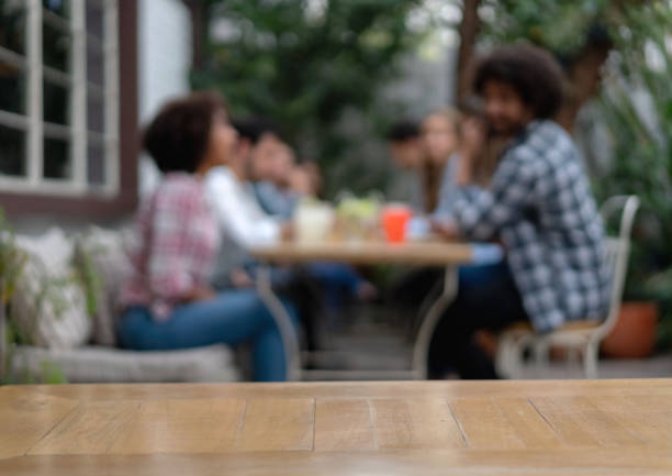 Group of people at a restaurant - focus on foreground on the table
