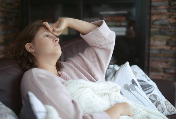 istock young girl is sick in the room 1183996616