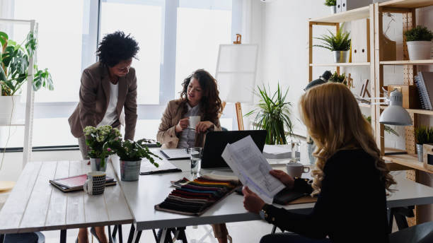 istock Diverse business team discussing work in their creative office 1183997251