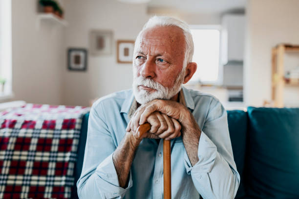 istock Elderly man sitting alone at home 1183998081