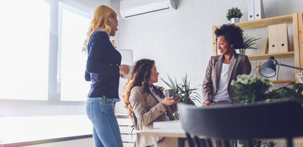 istock Diverse business team discussing work in their creative office 1183998566