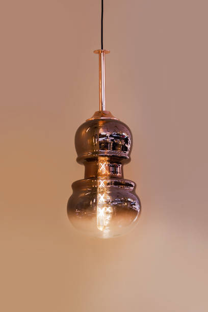 istock Modern streamlined mirror copper chandelier. Bubble metal copper shade pendant. 1183998648