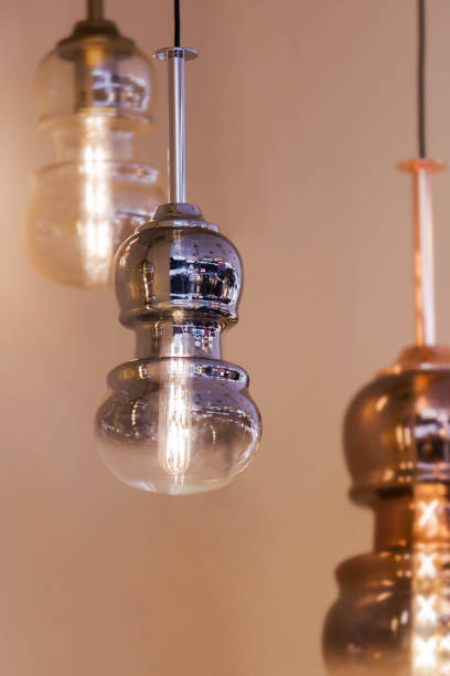 istock Modern streamlined mirror copper silver chandelier. Bubble metal glass shade pendant. 1183998653