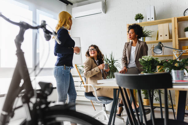 istock Diverse business team discussing work in their creative office 1183998846