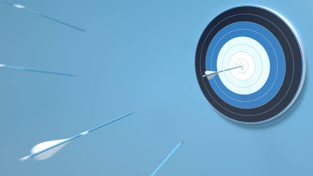 istock Multiple arrows hit the center of an archery target, isolated on blue background, 3D rendering 1183999742