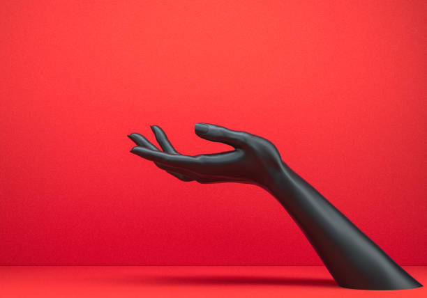 istock Showing hand. Black open palm presenting gesture isolated on red background, female hand sculpture, art fashion concept, modern promo creative banner, 3d rendering, 1184000679
