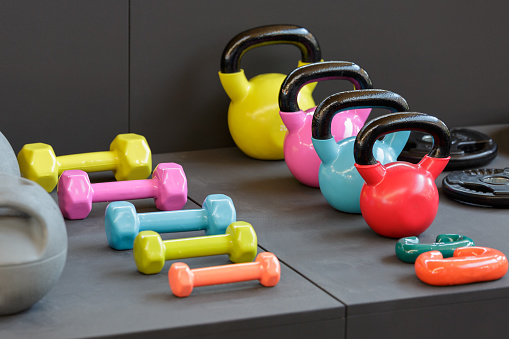 Colorful Kettlebells and Gym Dumbbells for Fitness.