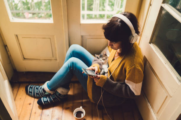 istock Relaxed girl with cat at home 1184002515