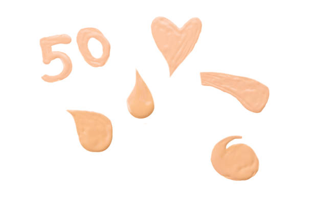 istock Liquid foundation swatch isolated on white background. Close Up of makeup cream sample. 1184004106