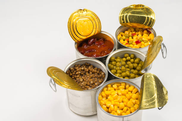 istock Canned food on white background. Green pea, beans, corn, lentils. 1184004190