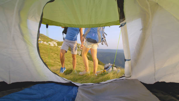 istock CLOSE UP: Unrecognizable active couple pick up their backpacks and go on a hike. 1184004535
