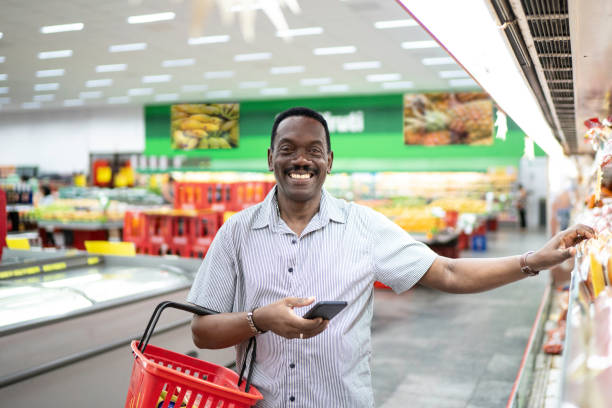 istock Mature man choosing products in supermarket 1184004777