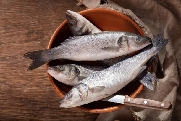 istock fresh fish are ready for cooking on a wooden table 1184005800