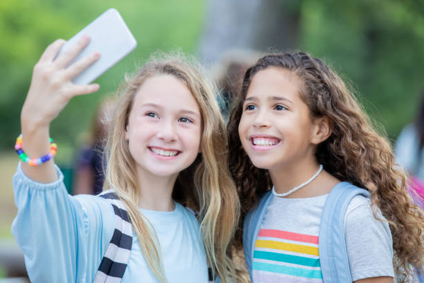 istock Young middle school students take selfie on first day of school 1184008826