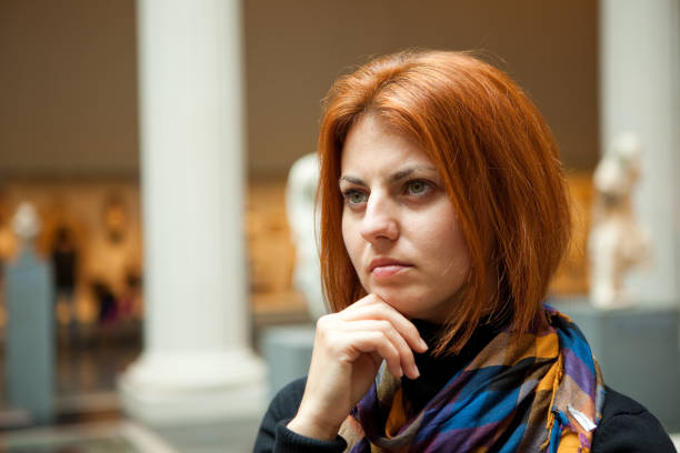 istock Woman in museum looking at fine art statue 118401000