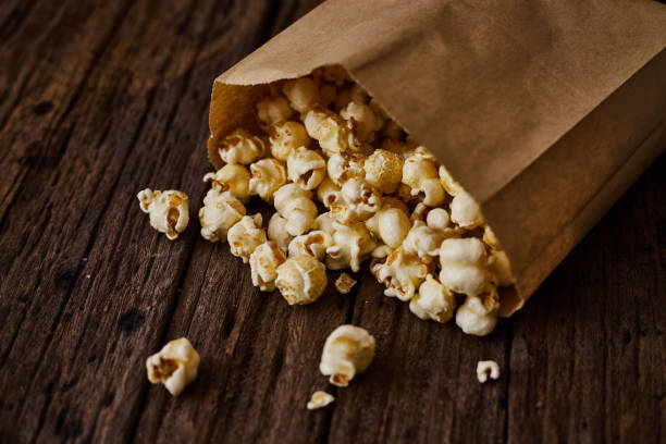 istock Delicious popcorn with caramel on wooden background. 1184010233