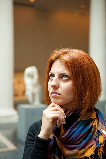 istock Woman in museum looking at fine art statue 118401028