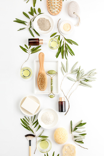 Spa concept with olive oil and olive leaf extract natural cosmetic ingredients, flat lay composition