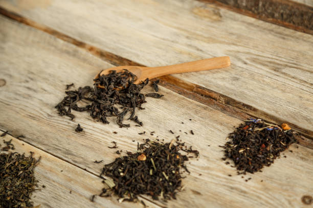 istock different varieties of natural tea on a bamboo spoon on a wooden background 1184012959