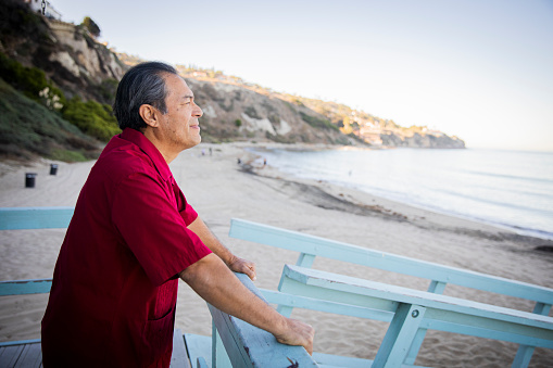 A Portrait of a senior Hispanic man at the beach