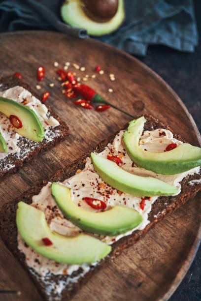istock Preparing Vegetarian Avocado Pizza with Cottage Cheese and Chili 1184014955