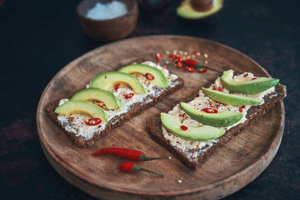 istock Preparing Vegetarian Avocado Pizza with Cottage Cheese and Chili 1184014964