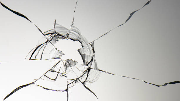 istock glass crack hole from a ball on a white background 1184015031