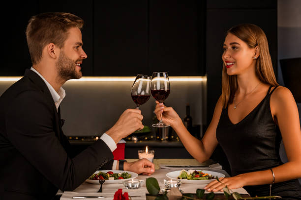 istock Young couple enjoying romantic dinner together 1184016387