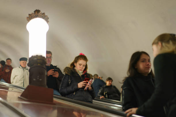 Moscow, Russia - October 24, 2019: People go down. Photography of subway escalator. Touristic concepts.