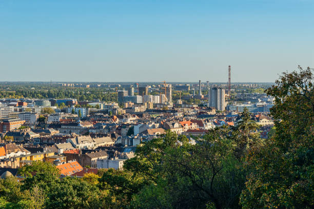 Panoramic cityscape view of hungarian capital city of Budapest (District XI) from the Gellert Hill. Budapest, Hungary - October 01, 2019: Panoramic cityscape view of hungarian capital city of Budapest (District XI) from the Gellert Hill. gellert stock pictures, royalty-free photos & images