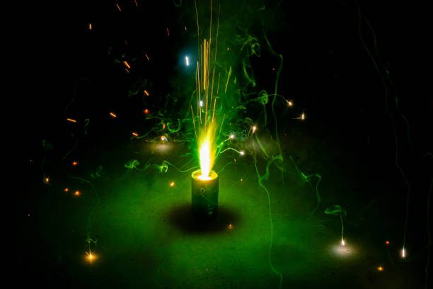 istock Green color flower pots fireworks(tubri) burning on the ground 1184021249