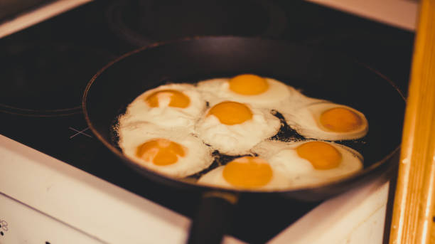 istock Frying Egg in a Cooking Pan in Domestic Kitchen 1184021289
