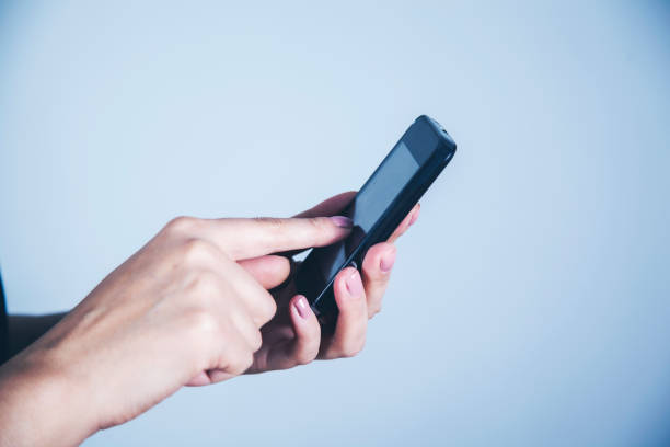 istock woman hand smart phone 1184022464