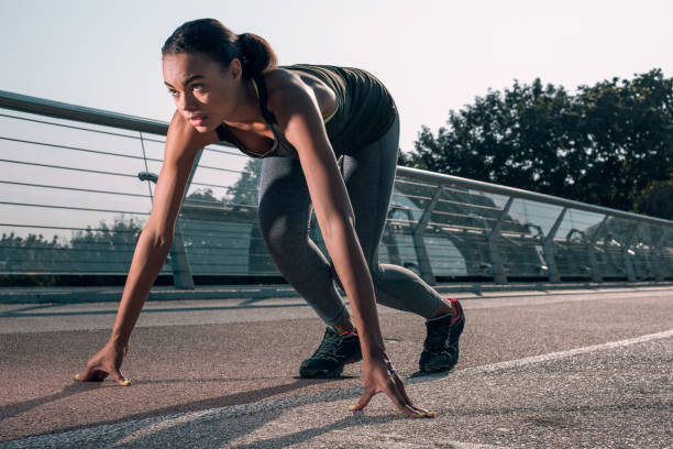 istock Confident runner at the start looking away stock photo 1184025655