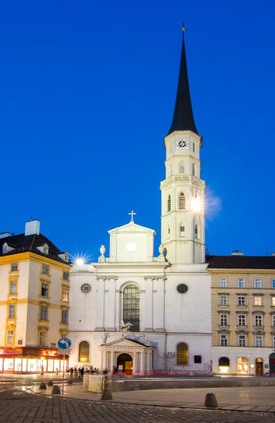 istock St. Michael church on Michaelplatz square at night, Vienna, Austria 1184028089