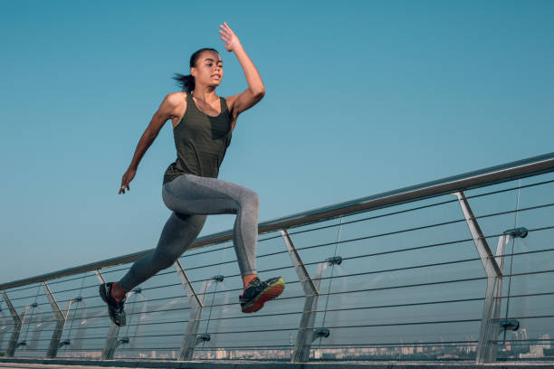 istock Professional athlete running fast outdoors stock photo 1184028291