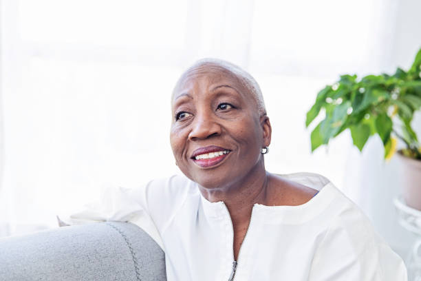 istock Senior Woman Relaxing on a Couch 1184028516
