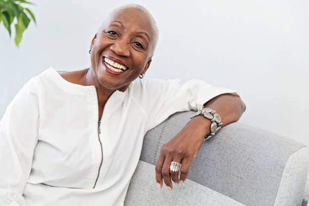 istock Senior Woman Relaxing on a Couch 1184028519